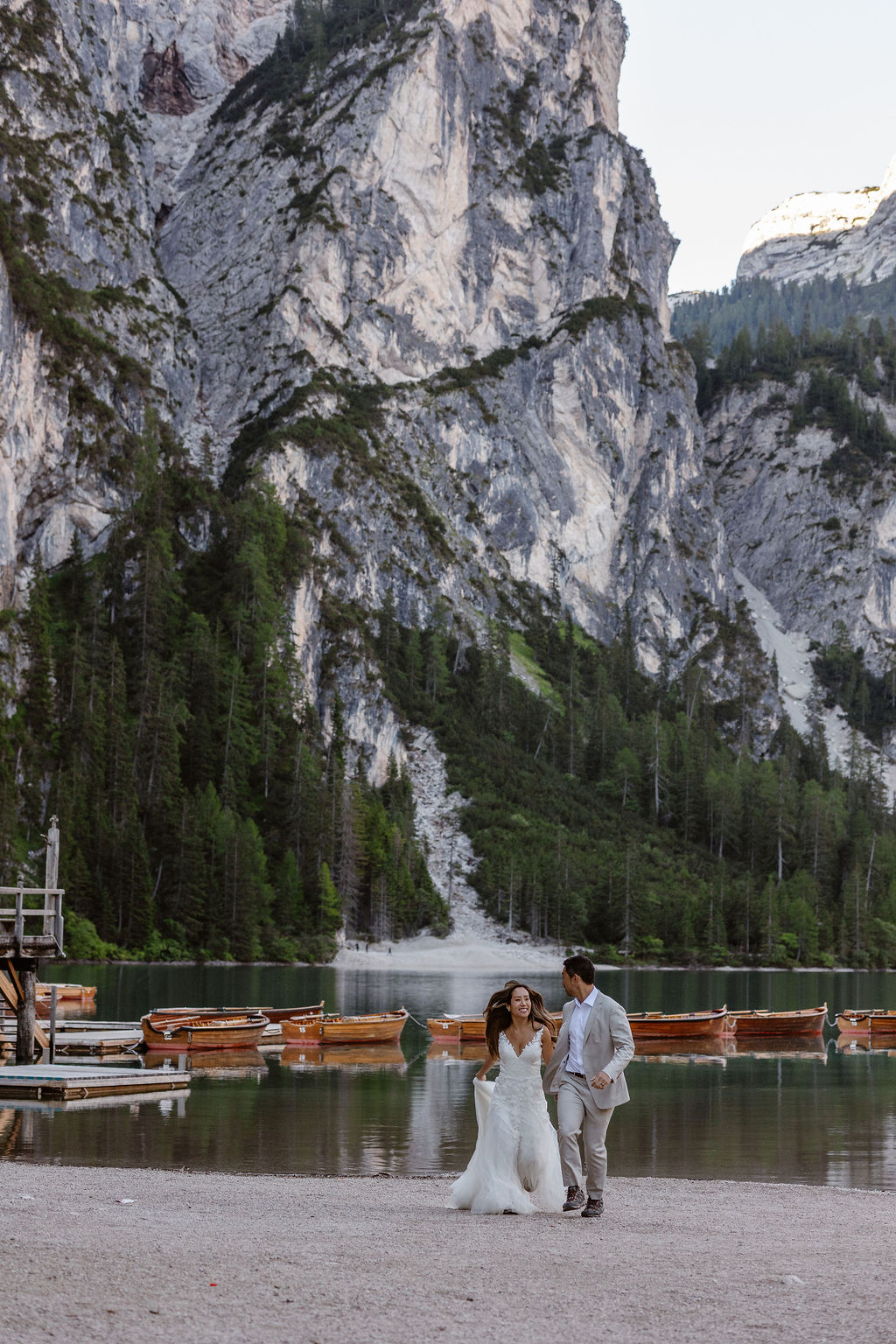 Rachel and Ned running Lago di Braies Dolomites